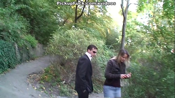 Blonde babe gives blowjob in a public outdoor setting