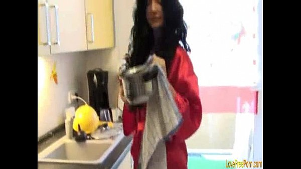 Teen brunette gives boyfriend blowjob in kitchen