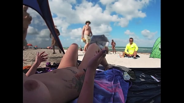 Blonde wife Kandii Kiss catches voyeur jerking off at nude beach