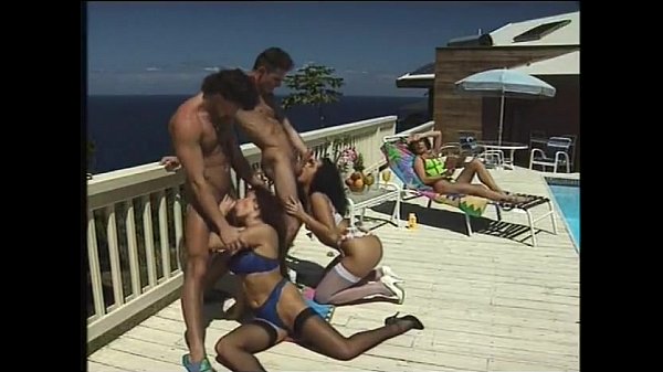 Erika Bella sucks cock by the pool