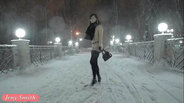 Jeny Smith walks naked in snowfall through city streets