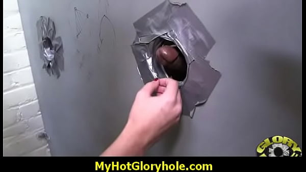 Black woman gives interracial blowjob at gloryhole