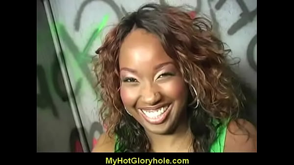 Ebony woman gives black man a gloryhole blow job