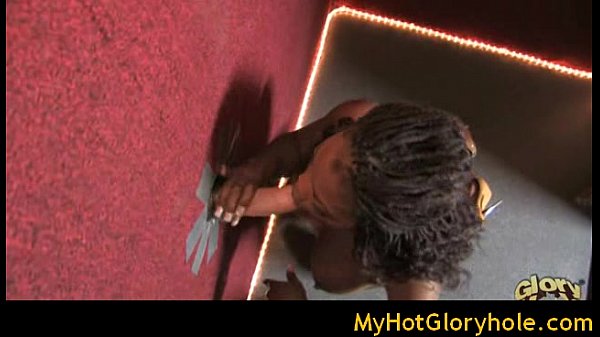 Ebony girl sucks white cock at the gloryhole