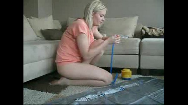 Teen girl plays with herself on inflated beach mat at home