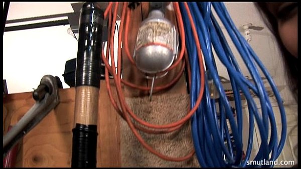 Megan uses shovel for anal insertion and sex play