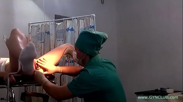 Lana Mc in white socks on a gynecological chair medical exam