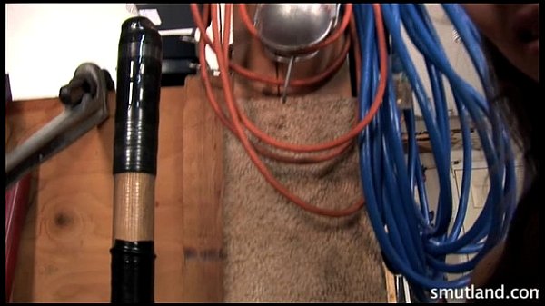 Megan plays with huge tool in shed