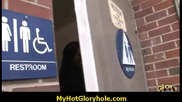 Ebony babe sucks big black cock at gloryhole