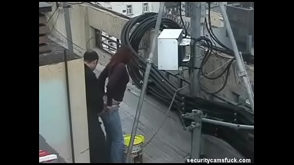 Brunette amateur caught fucking on rooftop by spy cam