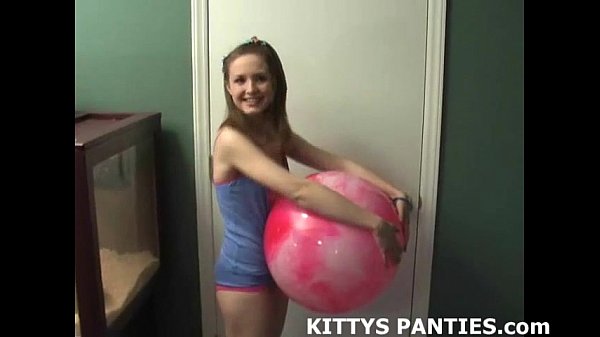 Teen girl flashes panties outdoors while playing with dolls