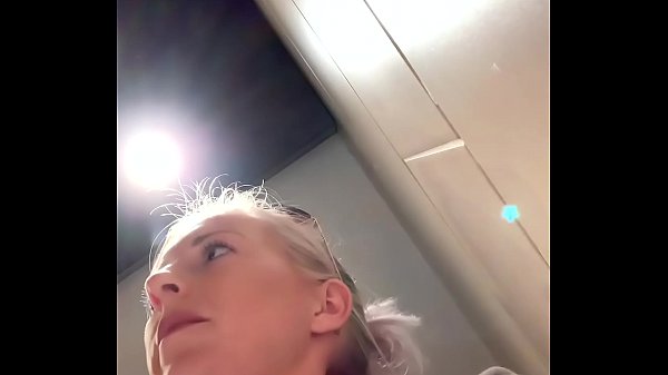 Blonde Leonie Pur masturbates in public restroom
