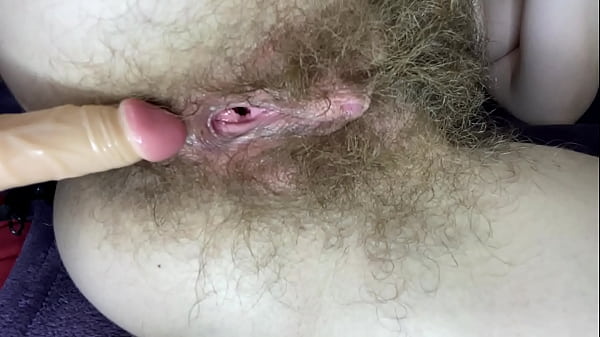 Hairy girl fucks herself with dildo closeup