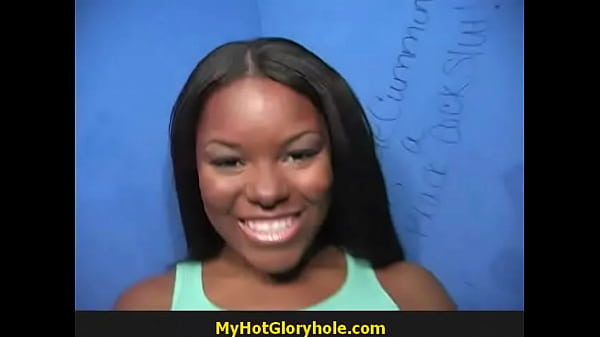 Ebony woman blows and sucks cock at a glory hole