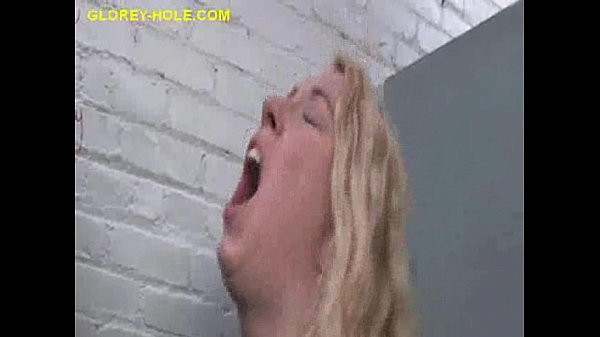 Blonde babe sucks big cock in gloryhole