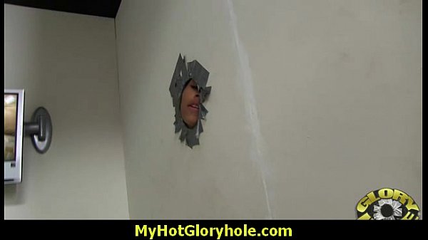 Young white girl gets her mouth deep throated by a big black cock in a public gloryhole