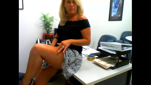 Horny milf strips and masturbates in office