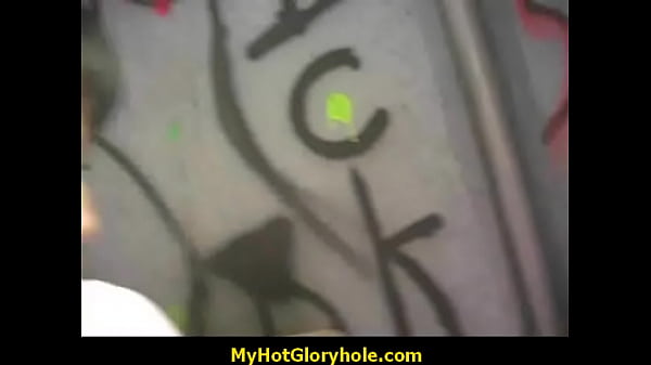 Black woman blows huge cock in a gloryhole
