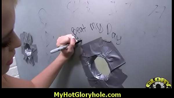 Black woman sucks black cock through gloryhole