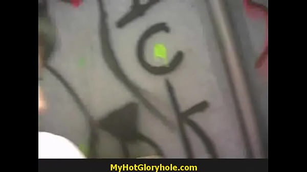 Ebony teen sucks cock at gloryhole