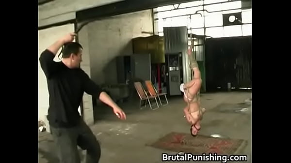 Petite girl with big tits gets whipped and spanked with paddles in bondage fetish scene