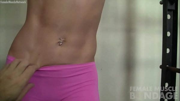 Muscle girl chained up in gym for POV bondage