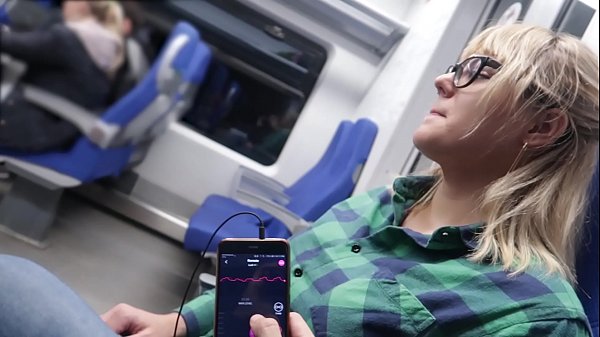 Teen girl uses remote control toy for orgasm on train