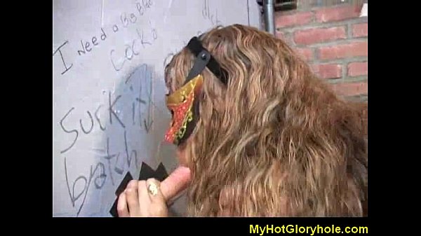 Ebony woman sucks cock at gloryhole