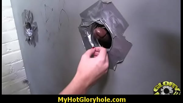 Black woman gives interracial blowjob at gloryhole