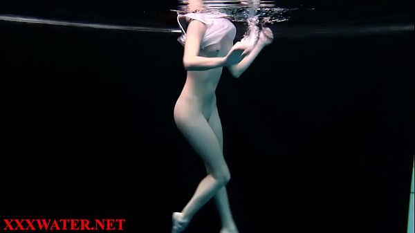 Blonde teen caught nude swimming underwater at the beach pool