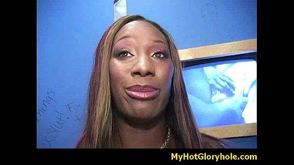 Ebony woman performs a hot interracial blow job on a white man