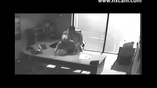 Blond college student caught on security camera having sex at office desk on web cam