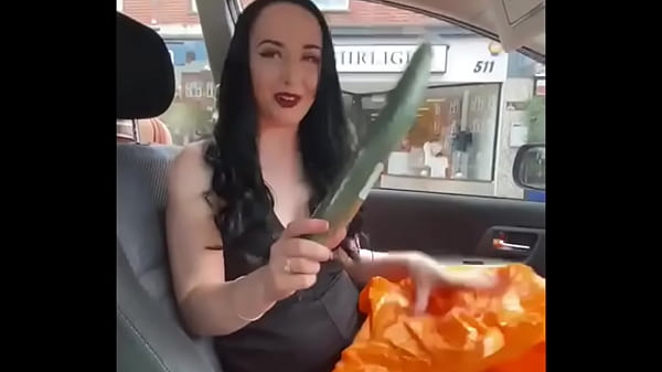 Ellie Louise plays with cucumber in public