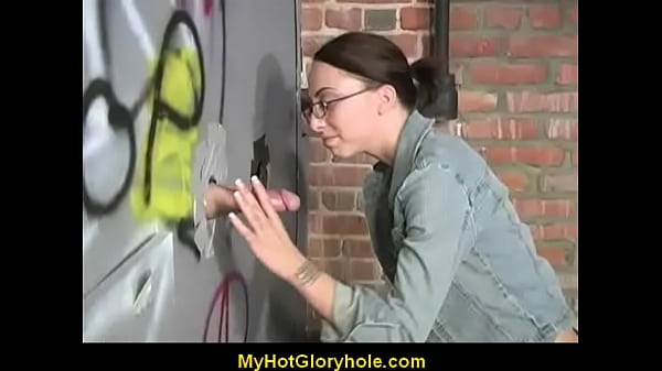 Ebony girl sucks cock at the gloryhole