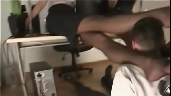 Woman in stockings gives foot worship to couple in high heels