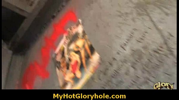 Ebony woman performs interracial gloryhole blowjob with white male