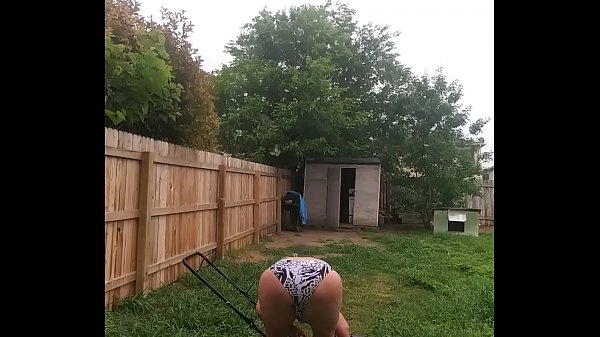 Hot And Juicy1 mows the lawn in a red sexy swimsuit