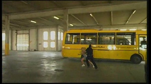 Blonde school bus driver gives blowjob while wearing glasses