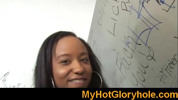 Ebony girl sucks big white cock in gloryhole
