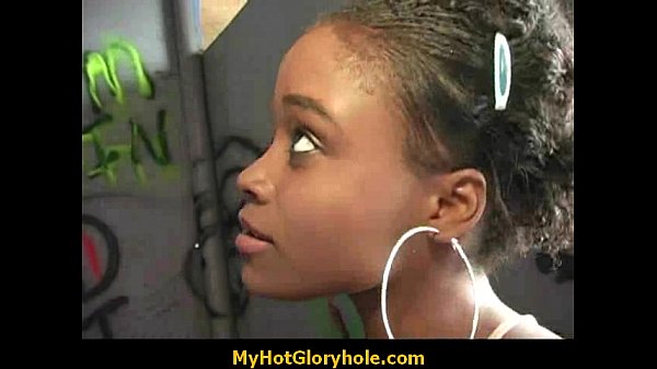 Ebony woman gives interracial gloryhole blowjob