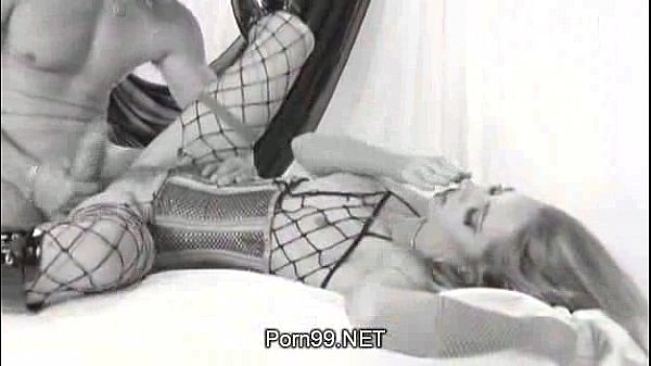 Blonde in corset and fishnet gets hardcore fuck