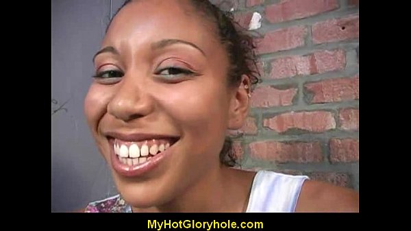 Ebony woman gives stranger a gloryhole blowjob in bathroom