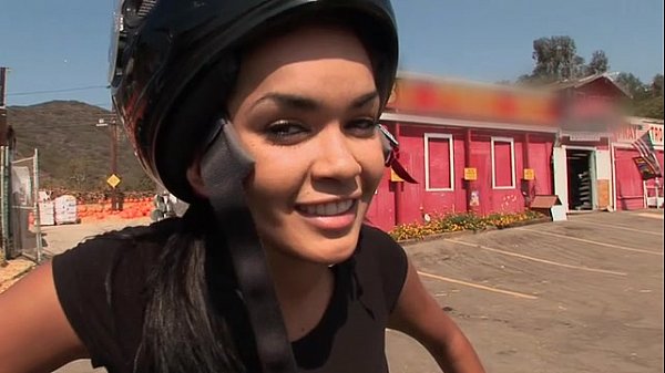 Daisy Marie rides a motorcycle