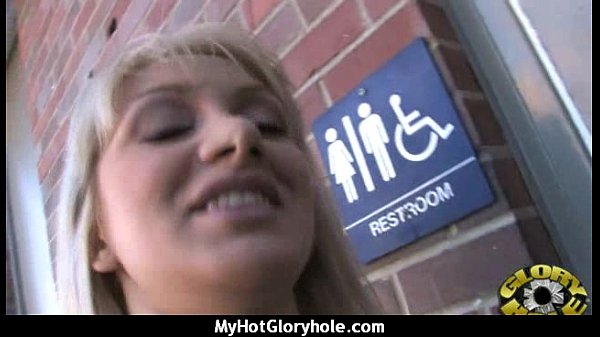 Ebony milf sucks cardboard box gloryhole cock in interracial blowjob scene