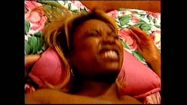 Black woman with big tits gives interracial blowjob