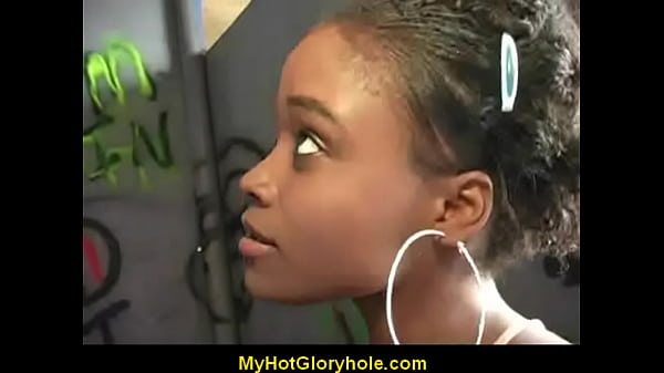 Ebony girl sucks cock at gloryhole