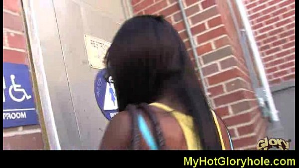 Ebony black woman blowjob through a gloryhole with a big dick