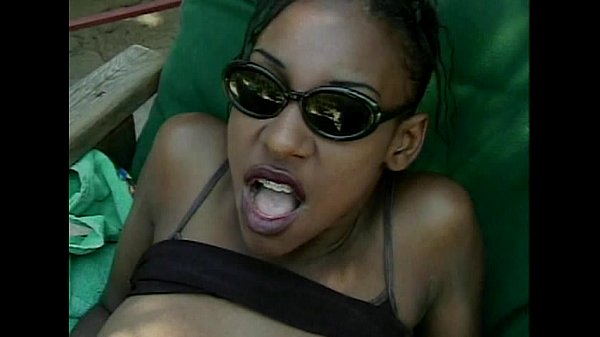 Black woman in glasses gives outdoor blowjob