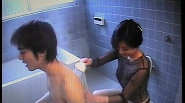 Asian milf gives lucky boy a cumshot blowjob