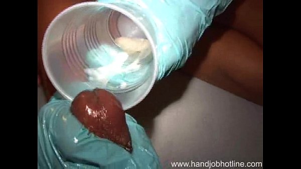 Ebony woman in latex glove gives handjob cumshot